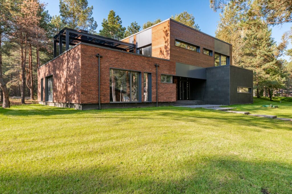 A home built on sustainable living principles with solar panels and designed to blend in with nature.